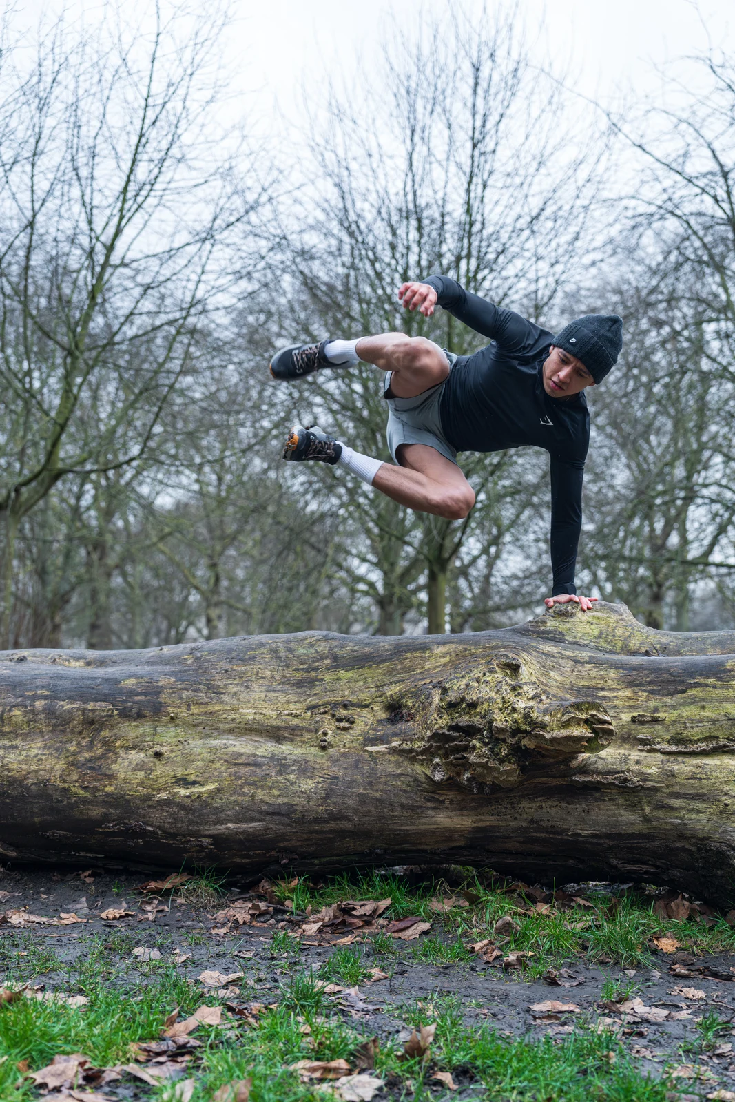 Jorge jumping over log in London park